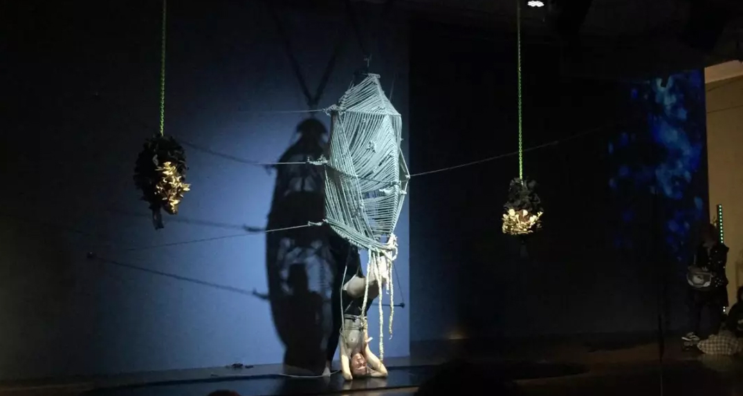 Exosmosis — performer emerging from rope pod, Samstag Museum of Art, 2022